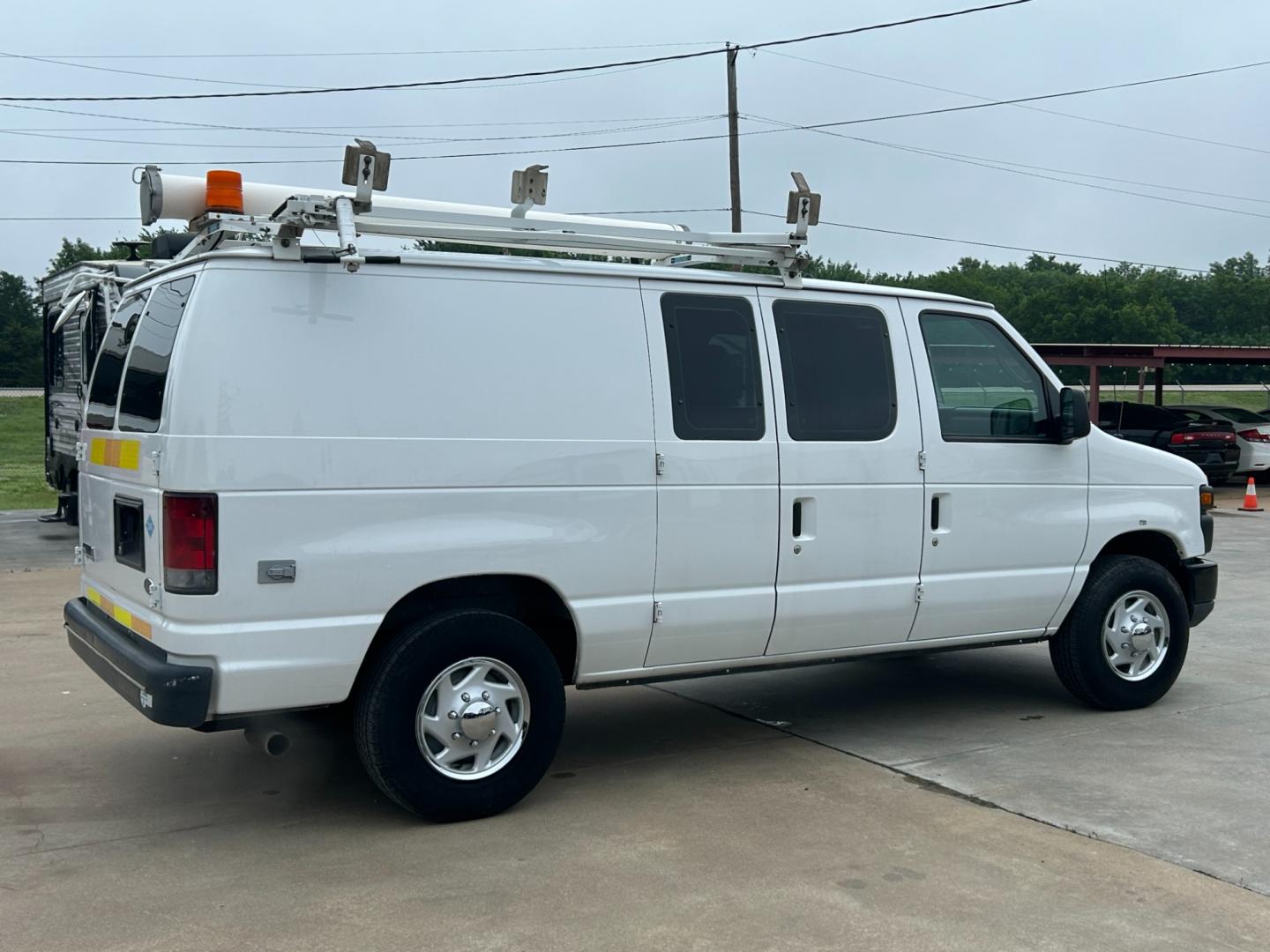 2010 White /Gray Ford E-Series Van E-250 (1FTNE2EL2AD) with an 5.4L V8 SOHC 16V engine, 4-Speed Automatic transmission, located at 17760 Hwy 62, Morris, OK, 74445, (918) 733-4887, 35.609104, -95.877060 - 2010 FORD E-SERIES VAN E-250 5.4 V8 DEDICATED CNG (COMPRESSED NATURAL GAS) DOES NOT RUN ON GASOLINE. FEATURES MANUAL SEATS, MANUAL LOCKS, MANUAL WINDOWS, MANUAL MIRRORS, AM/FM STEREO. IT IS EQUIPPED WITH A CNG FUELING SYSTEM, IT RUNS ON COMPRESSED NATURAL GAS. A PREMIER ALTERNATIVE FUEL THAT IS EXTR - Photo#4